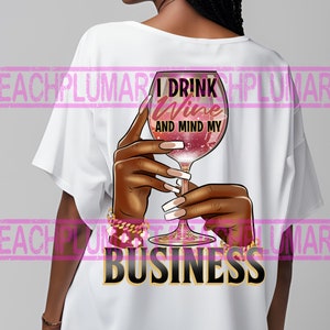 May include: White t-shirt with a graphic of a hand holding a glass of red wine. The text "I drink wine and mind my business" is printed on the shirt.