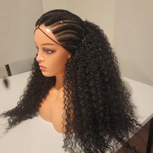 May include: A black wig with long, curly hair. The wig is styled with cornrows on the top of the head and the hair is pulled back into a ponytail.