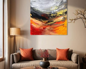 May include: Abstract painting with a swirling, layered design in shades of black, white, red, orange, and gold. The painting is displayed on a wall in a living room setting.