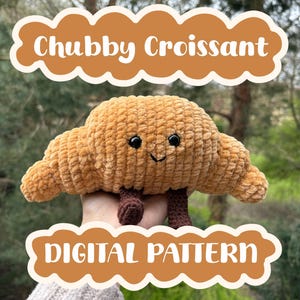 May include: A plush, brown crocheted croissant with black eyes and a smiling mouth. The text "Chubby Croissant" and "DIGITAL PATTERN" are displayed in a brown cloud-shaped design.