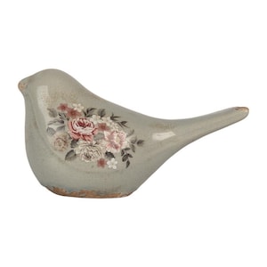 Peut inclure: Une figurine d'oiseau en céramique gris clair avec une finition émaillée craquelée et un motif floral détaillé sur le côté. Le motif floral présente diverses nuances de rose, de blanc et de feuilles vert foncé, avec une base à texture brune usée.