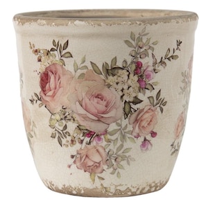 Peut inclure: Pot de fleurs en céramique crème avec une finition vieillie. Le pot présente un motif floral de roses roses et d'autres fleurs. Le pot a une large ouverture et une surface légèrement texturée.