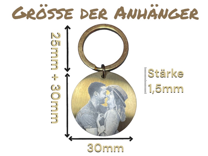 May include: A gold-colored metal keychain with a round, engraved photo charm. The charm is 30 mm in diameter and 1.5 mm thick. The keychain is 25 mm + 30 mm in length.