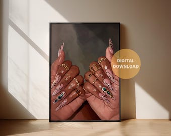 May include: Digital download art print featuring a close-up of hands with long, almond-shaped nails. The nails are painted in a light pink with black and gold accents. The hands are adorned with gold rings. The print is in a black frame.