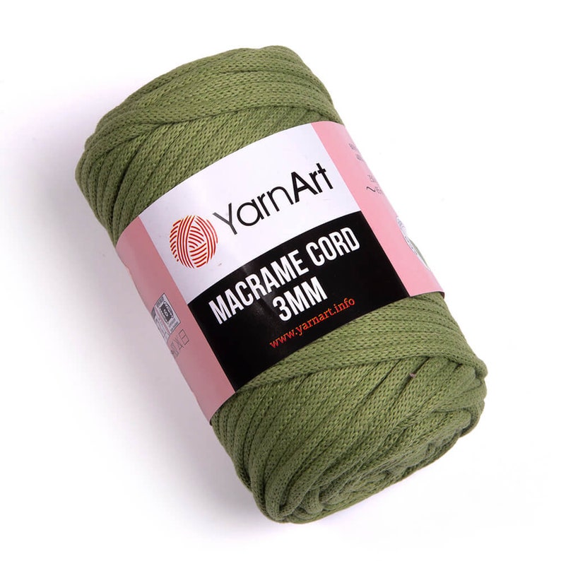 May include: A roll of green macrame cord, 3mm thick, with a label that reads 'YarnArt Macrame Cord 3MM www.yarnart.info'