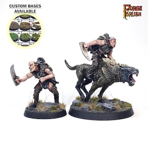 May include: Two fantasy miniatures, one of a goblin riding a wolf, the other of a goblin holding a sword. Both are painted in a realistic style with detailed features. The miniatures are on black bases with green grass.