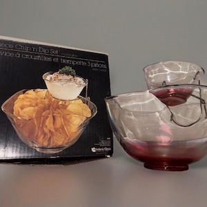 May include: A set of three ceramic mugs with a speckled, matte finish. The mugs are in shades of cream, light gray, and dark gray. Each mug has a simple, minimalist design, perfect for coffee or tea.