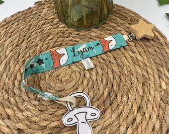 Personalized pacifier clip, baby, child, in patterned fabrics with a wooden clip