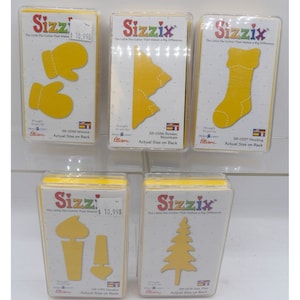 Juego de cartuchos de troqueladora Sizzix con estuches: manoplas, medias, velas, árbol y montaña