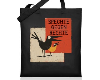 May include: Black tote bag with a red, white, and orange design featuring two birds and the text "Spechte Gegen Rechte".