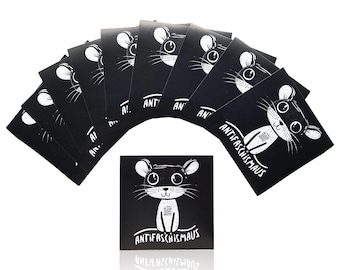 May include: A collection of black square cards with a white cartoon mouse illustration. The mouse has large eyes and ears, and the text "ANTIFASCHISMAUS" is written below it. The cards are arranged in a fan shape.