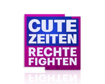 May include: A rectangular sign with the words "CUTE ZEITEN RECHTE FIGHTEN" in white, stacked on top of each other. The text is set against a blue background, framed by a pink border. The sign's reflection is visible below.