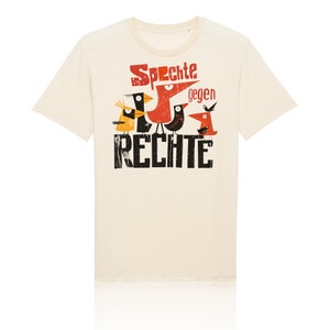 May include: A beige t-shirt with a graphic print of birds and the text "Sprechte gegen RECHTE".