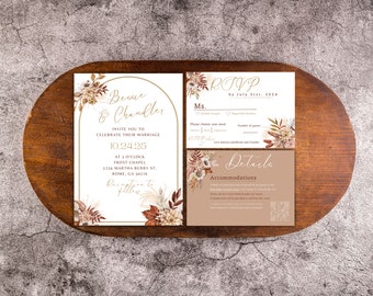 May include: A wedding invitation suite with a rustic theme. The invitation features a floral design with dried flowers and pampas grass in shades of brown, beige, and white. The text reads "Besare & Chandler" and includes the date "10.24.25". The RSVP card features a floral design and the text "RSVP by July 31st, 2024". The details card features a floral design and the text "Details" and "Accommodations".