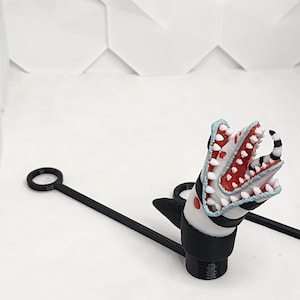 Adorno de paja con forma de gusano de arena