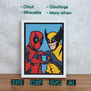 Puede incluir: Una ilustración digital enmarcada que muestra a Deadpool con traje rojo y negro y a Wolverine con traje amarillo y azul, ambos formando un corazón con sus manos. El texto superior dice: - Cricut - Glowforge - Silhouette - Many others.