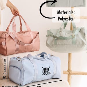 May include: Three duffel bags, one pink, one light blue, and one light green. The light blue bag has a hockey-themed design with the text "LUCAS 22". The bags are 10.5 inches high, 9 inches deep, and 18.5 inches wide. The bags are made of polyester.