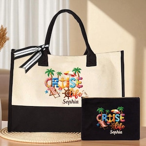 May include: A canvas tote bag and matching pouch set. The tote bag is cream-colored with a black bottom and handles, and a black and white striped bow. The words "CRUISE life" are printed on the front, along with a name.