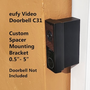 May include: Black custom spacer mounting bracket for a eufy Video Doorbell C31. The bracket is adjustable from 0.5 to 5 inches. Doorbell not included.