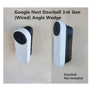 May include: Two white and black Google Nest Doorbell 3rd Gen (Wired) Angle Wedges are shown. The text "Google Nest Doorbell 3rd Gen (Wired) Angle Wedge" is at the top. The text "Doorbell Not Included" is at the bottom.