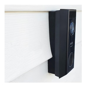 May include: A black Eufy Security video doorbell mounted vertically on a white wall. The device features a circular camera lens at the top, the Eufy Security logo in the center, and a circular button at the bottom, all encased in a rectangular housing.