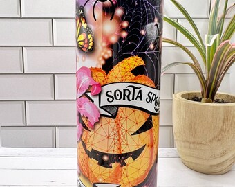 May include: A tall, stainless steel tumbler with a colorful design featuring a pumpkin, spider, butterfly, and flowers. The tumbler has a black and purple background with a spider web pattern. The text "Sorta Spooky Sweet" is printed on the tumbler.