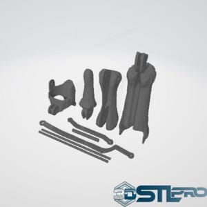 May include: A collection of gray 3D-printed components, including various shapes and sizes. The objects appear to be parts of a larger assembly, with a focus on mechanical or structural elements. The image is set against a plain white background.
