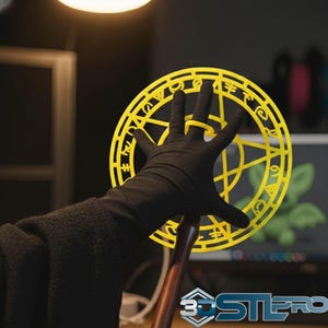 May include: A yellow, circular prop with intricate cut-out designs, held by a gloved hand. The prop features a star-like pattern and is mounted on a wooden handle. The image is set against a blurred background with a computer screen.