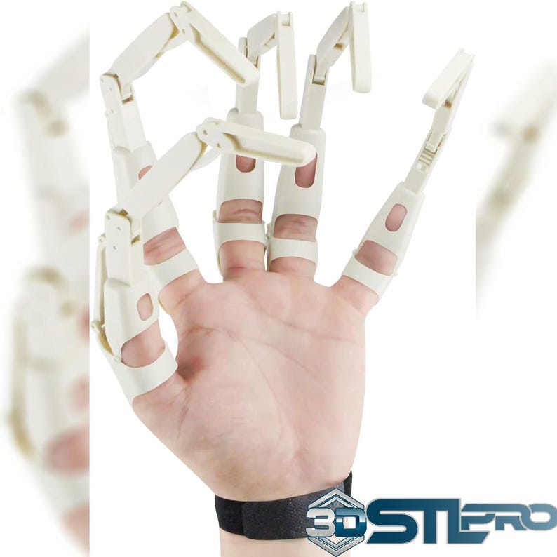 May include: A cream-colored articulated hand model, with each finger segment connected by hinges. The model is worn on a person's hand, secured by a black wrist strap. The 3DSTEREO logo is visible at the bottom right.