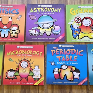 May include: A collection of seven Basher Science and Basher Basics educational books featuring colorful cartoon characters on the covers. Titles include Physics, Astronomy, Grammar, Biology, Microbiology, The Periodic Table, and Chemistry.