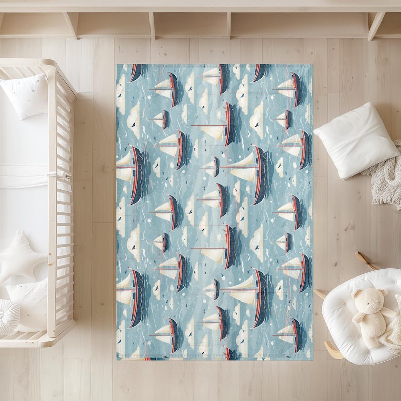 May include: A rectangular area rug with a nautical theme. The rug features a repeating pattern of sailboats in shades of blue, red, and white against a light blue background. White clouds and birds are also present in the design.