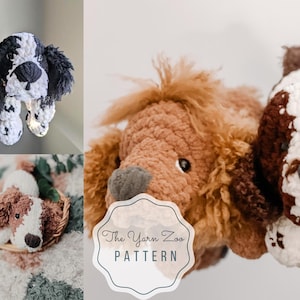 May include: Three crocheted dog plushies in different colors and patterns. The plushies are brown, black and white, and white with brown spots. The plushies are all sitting on a white and brown blanket. The text "The Yarn Zoo Pattern" is visible in the image.