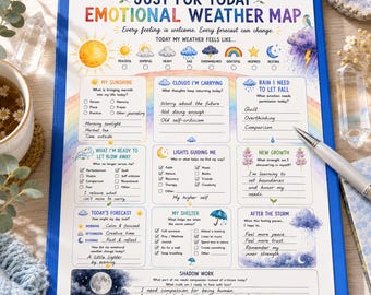May include: A blue clipboard holding a printed emotional weather map worksheet with colourful illustrations of suns, clouds, and rainbows. The page features sections for tracking feelings, thoughts, and self-reflection with handwritten text in black ink.