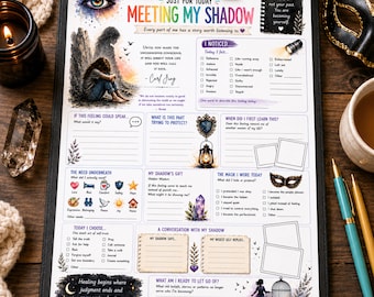 May include: A printed worksheet titled Meeting My Shadow on a black clipboard. The page features sections for self-reflection, including checkboxes for emotions, prompts for shadow work, and illustrations of an eye, a lantern, and a crystal.