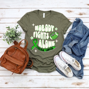 Football Cancer T Shirt, Tackle Cancer Awareness Shirt, Nobody Fights Alone Cancer Shirt, Cancer Ribbon Tshirt, Pink October Cancer Tshirt