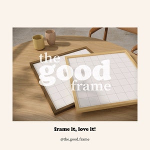 May include: Two wooden picture frames on a wooden table. The larger frame is light brown and the smaller frame is dark brown. The text "the good frame" is printed on the image.