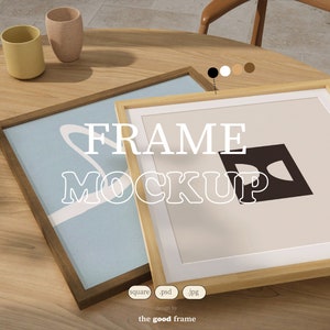 May include: Two wooden picture frames on a wooden table. The frame on the left has a light blue background with a white abstract design. The frame on the right has a beige background with a black abstract design. The text "FRAME MOCKUP" is superimposed on the image.