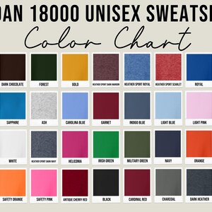 May include: Color chart for Gildan 18000 unisex sweatshirts, showcasing a variety of colors. The chart displays swatches of colors such as cherry red, dark chocolate, forest green, gold, and more. The text "Color Chart" is written in a cursive font.