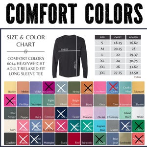 May include: A Comfort Colors 6014 heavyweight long sleeve tee size and color chart. The graphic displays a black long sleeve shirt with chest and length measurement lines, a sizing table in inches, and a grid of color swatches with names.