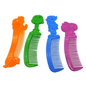 May include: Four colorful plastic combs. The combs are orange, green, blue, and pink. Each comb has a different character on the handle. The orange comb has a dog, the green comb has a tree, the blue comb has an alien, and the pink comb has a flower.
