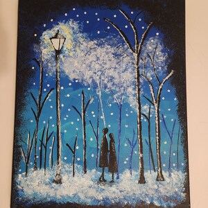Couple on a snowy night painting in a forest. Blue, black and white painting.