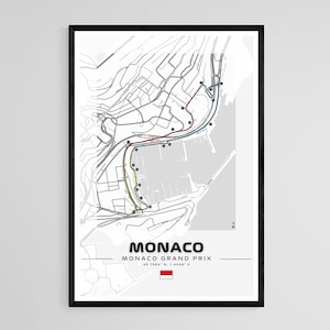 Peut inclure: Une carte en noir et blanc du circuit du Grand Prix de Monaco. La carte montre les rues de Monaco et le parcours de la course. Le texte "Monaco" et "Grand Prix de Monaco" est imprim&eacute; sous la carte. Les coordonn&eacute;es "43.7384&deg; N, 7.4208&deg; E" sont imprim&eacute;es sous le texte. Un petit drapeau rouge et blanc est imprim&eacute; sous les coordonn&eacute;es.