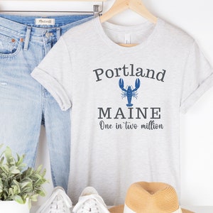 Portland Maine Blue Lobster t-shirt "It's One in Two Million" Unisex Jersey Short Sleeve Tee ME group family casco bay heart love