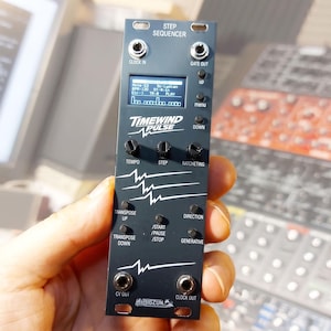 May include: A black modular synthesizer step sequencer module labeled Timewind Pulse. It features a digital display, three rotary knobs for tempo, step, and ratcheting, and various push buttons for transport controls, including start, pause, and stop.