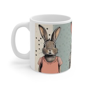 May include: A set of three ceramic mugs with a speckled, matte finish in cream, light grey, and dark grey. Each mug has a simple, minimalist design, suitable for coffee or tea.