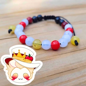 May include: A white ceramic mug with a black handle and the text "But First, Coffee" in a bold, black font. The mug is set against a neutral background, highlighting its simple design.