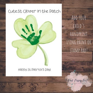 May include: Printable St. Patrick's Day craft for kids. A green shamrock with a space for a handprint. The text reads "Cutest Clover in the Patch" and "Happy St Patrick's Day!"  Add your child's handprint using paint or a stamp pad.