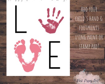 May include: A white Valentine's Day print with the word "LOVE" spelled out using a handprint, footprints, and the letters L and E. The print includes the text "Happy Valentine's Day!" and instructions to add hand and footprints.