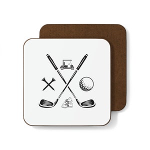 May include: Square white coaster with a brown border featuring a black golf-themed design. The design includes crossed golf clubs, a golf ball, golf cart, golf shoes, and tees. The coaster is made of a durable material.