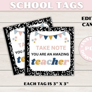 May include: Two square school tags with a black and white composition notebook border. The tags read "Take Note You Are An Amazing Teacher" with a banner and star design. Each tag is 3" x 3".
